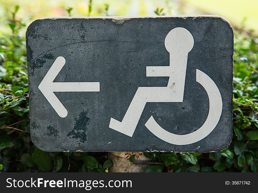 Wheelchair sign showing the way for the people who use wheelchair.