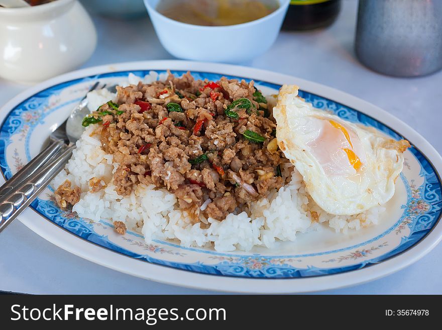 Rice with stir fried hot and spicy pork with basil