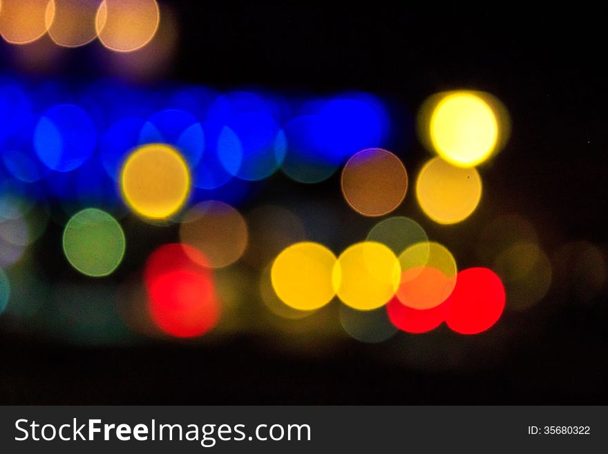 Abstract background of blurred warm lights with cool blue and purple background with bokeh effect. Abstract background of blurred warm lights with cool blue and purple background with bokeh effect