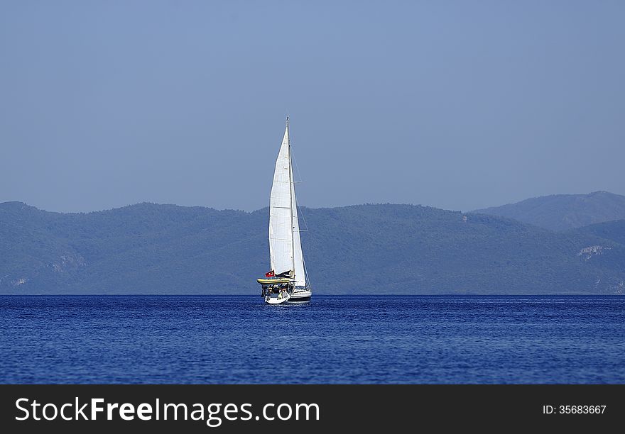 A sailboat in the Mediterranean. A sailboat in the Mediterranean