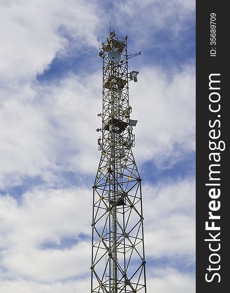 A high tower with various electronic equipments for communications. A high tower with various electronic equipments for communications