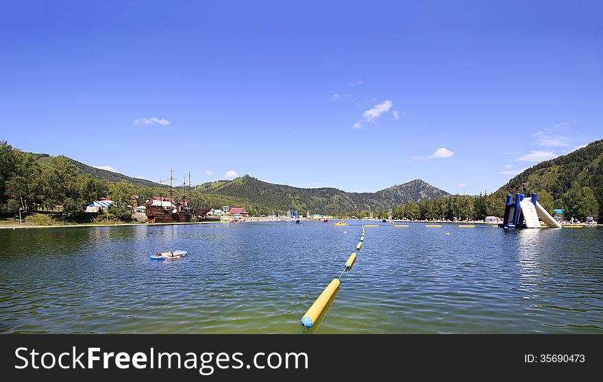 Artificial lake Biryuzovaya Katun for summer holiday. Altai. Russia.