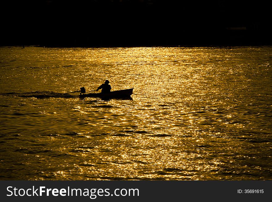 Small boat on sunshine in the evening