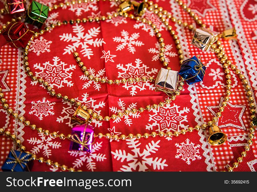 Various Christmas decor like a chain, bells, gifts, patterns