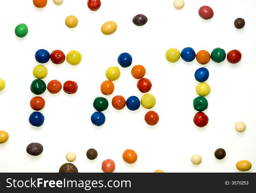 The word Fat written with candies.