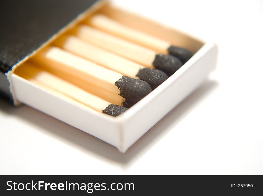 A few, macro isolated matchsticks