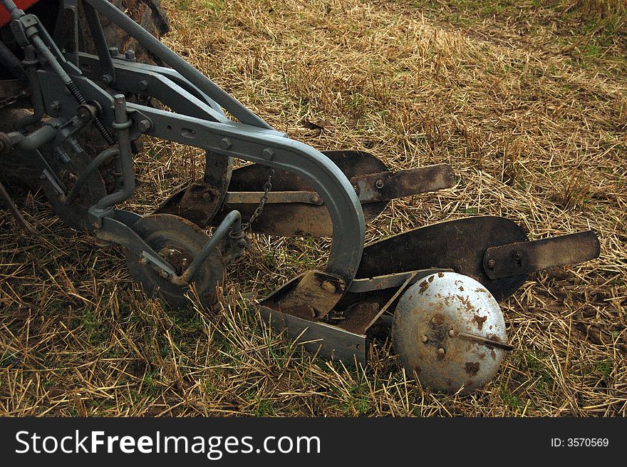 A Plough at a Local ploughing match. Wick, Scotland, Uk. This photograph shows a plough turning over the soil. Getting ready for sowing the seeds. The Plough Match was held in a field near wick in Scotland, A ploughing match is a contest between people who each plough part of a field. Nowadays there are usually classes for horse-drawn ploughs and tractor ploughing. Points are awarded for straightness and neatness of the resulting furrows. The annual 3-day long Irish National Ploughing Championships has grown into one of the largest outdoor events in the world, with commercial exhibits and a significant national media presence.