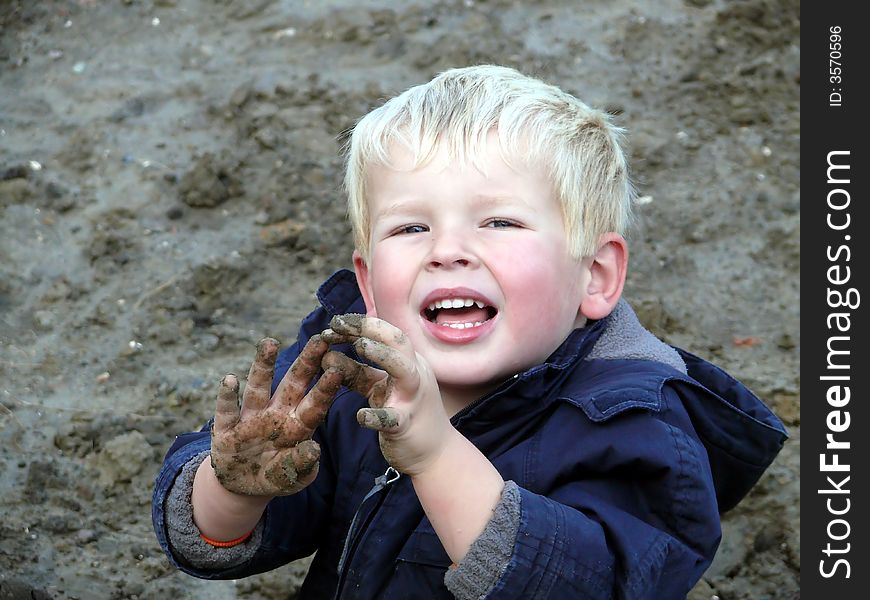 Toddler playing in the sand. Toddler playing in the sand