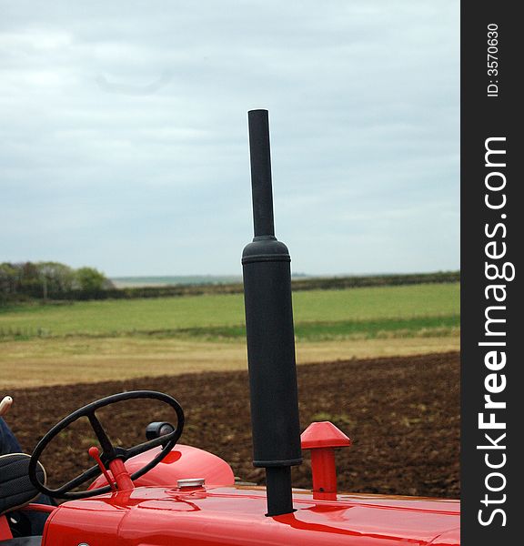 Tractor exhaust at a local plough match. The Plough Match was held in a field near wick in Scotland, A ploughing match is a contest between people who each plough part of a field. Nowadays there are usually classes for horse-drawn ploughs and tractor ploughing. Points are awarded for straightness and neatness of the resulting furrows. The annual 3-day long Irish National Ploughing Championships has grown into one of the largest outdoor events in the world, with commercial exhibits and a significant national media presence.