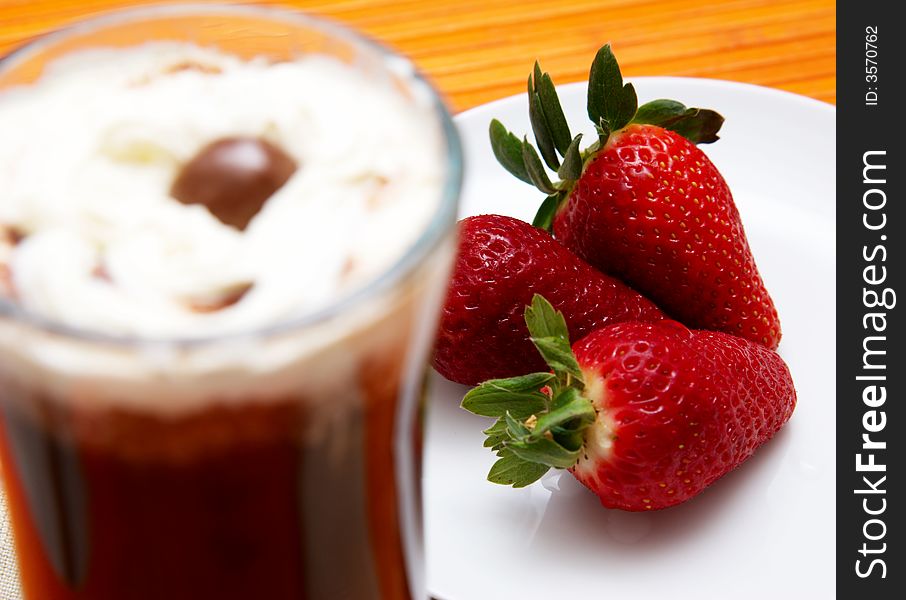 Cup of coffee and strawberries