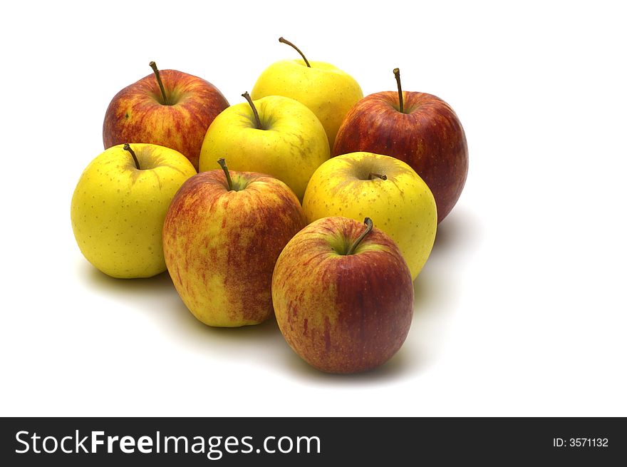 Yellow and red apples on white background