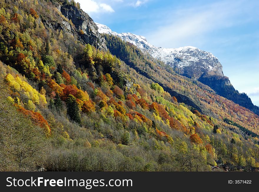 Mountain landscape in fall season (vibrant colours version); west alps Italy. Mountain landscape in fall season (vibrant colours version); west alps Italy