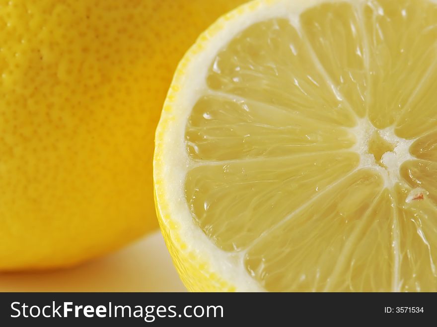 Fresh lemons in closeup background