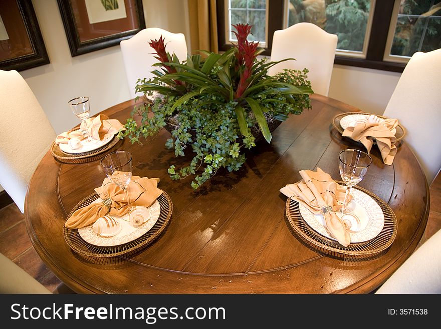 Festive dining table with luxurious dinnerware and decor.