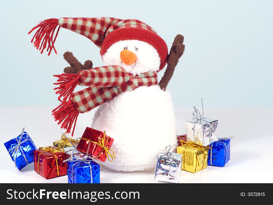Wind blown snowman with presents flying , christmas theme. Wind blown snowman with presents flying , christmas theme