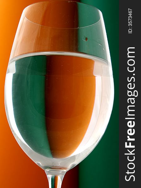 Wineglass in Green and Orange background