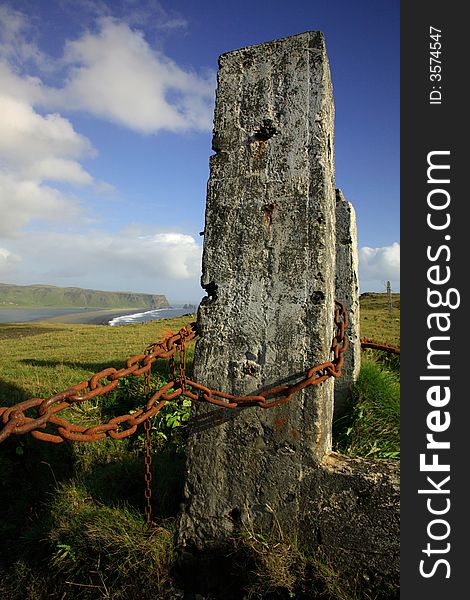 Posts and chain view to sea stacks Iceland