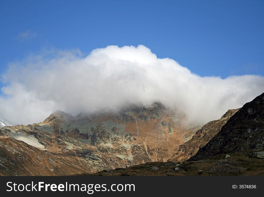 Mountain Covered By Clouds