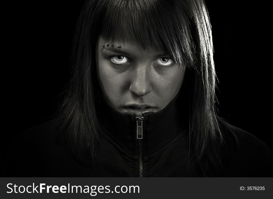 Angry girl looking straight to camera. Determined and confident. Angry girl looking straight to camera. Determined and confident.