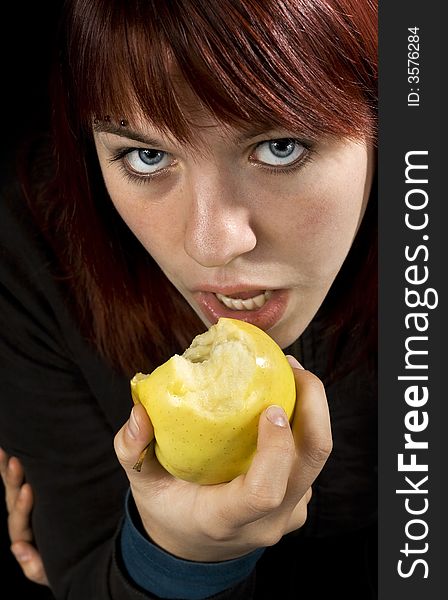 Girl biting/eating a delicious yellow apple and flirting with the viewer. Healthy lifestyle.

Studio shot. Girl biting/eating a delicious yellow apple and flirting with the viewer. Healthy lifestyle.

Studio shot.