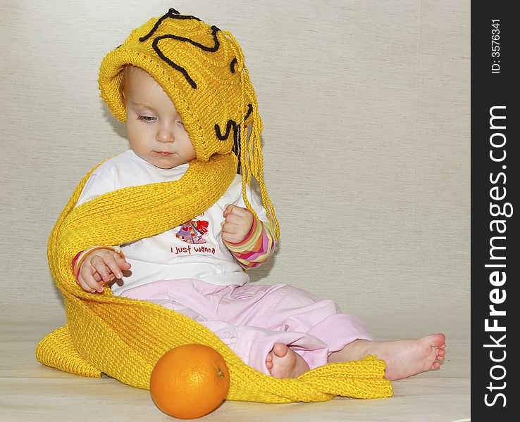 Beauty little girl, yellow cap and scarf. Beauty little girl, yellow cap and scarf