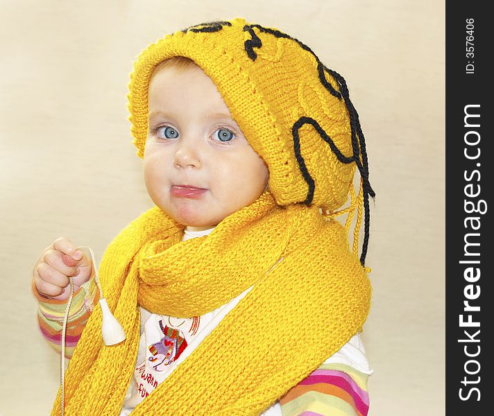 Beauty little girl, yellow cap and scarf. Beauty little girl, yellow cap and scarf