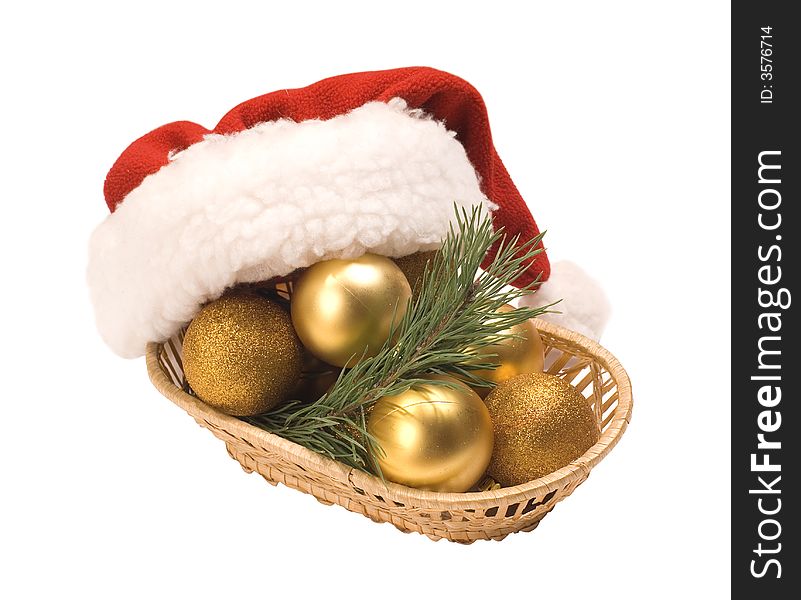 Basket with gold eggs and a cap Santa Claus. Basket with gold eggs and a cap Santa Claus