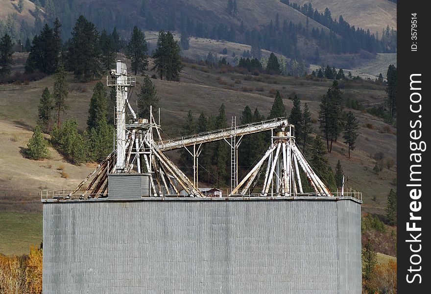 Grain silos in front of some hills. Grain silos in front of some hills.