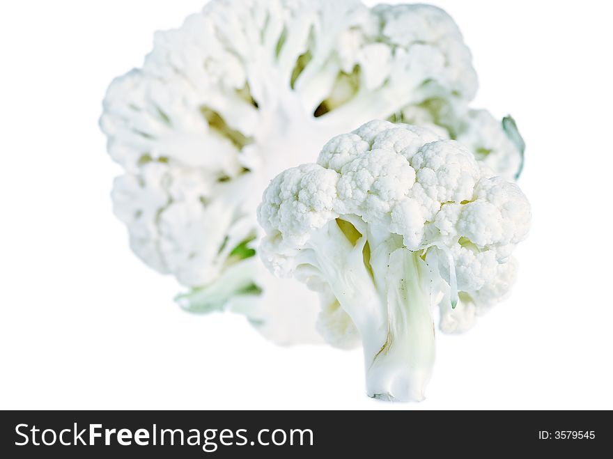 A sliced cauliflower composition with small DOF isolated on a white background