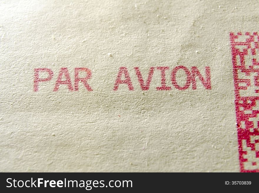 Par avion words printed on postage envelope. Par avion words printed on postage envelope