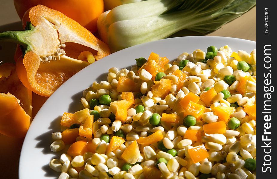 Fresh vegetables for cooking, orange pepper, green bean, corn, pine nuts.