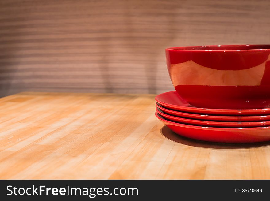 Reflective Ceramic Bowl on Wooden Kitchen Table. Reflective Ceramic Bowl on Wooden Kitchen Table