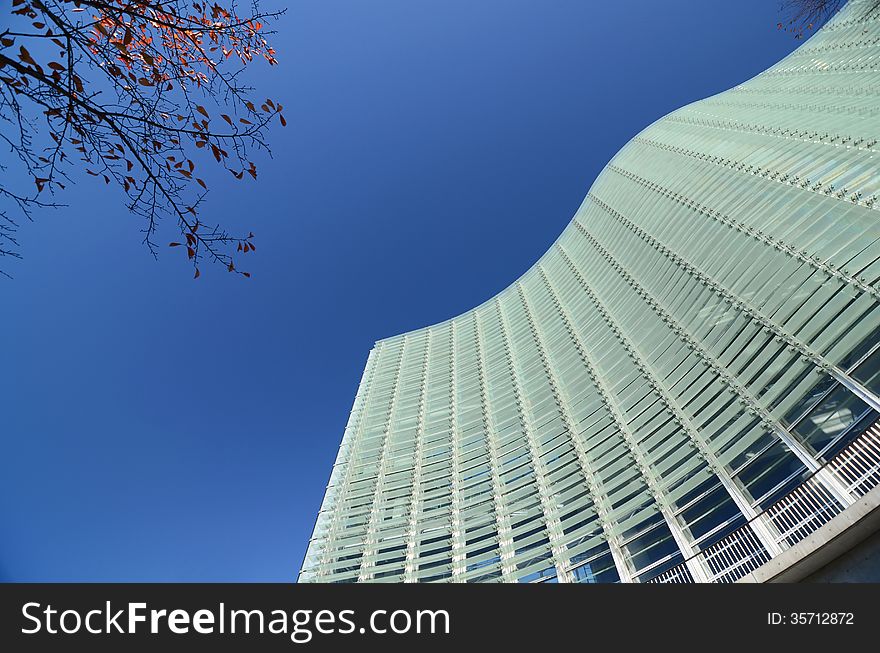 Facade - shapes from a modern building, with structural lines reflection