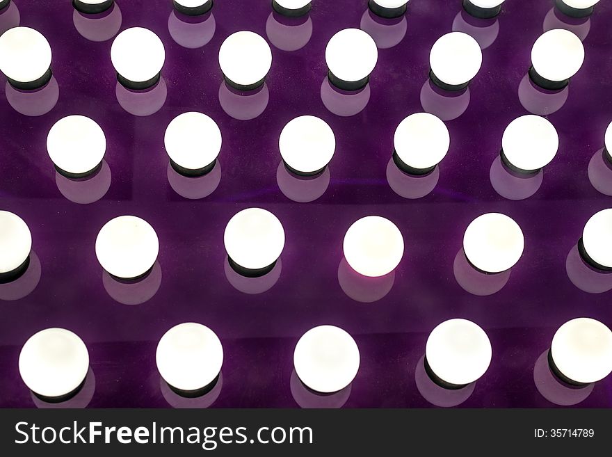 Many Round Illuminated Lights on Purple Board. Many Round Illuminated Lights on Purple Board