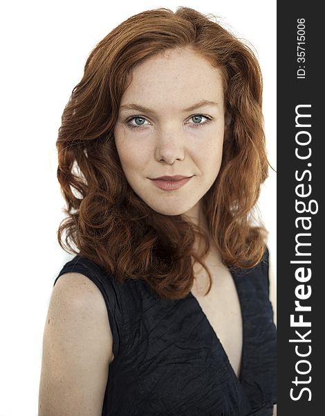 Young Woman with Beautiful Blue Eyes and Red Hair on White Backg