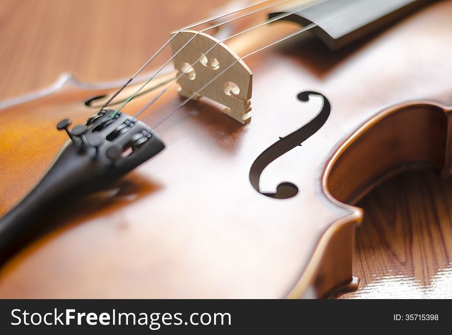 Violin on wood background