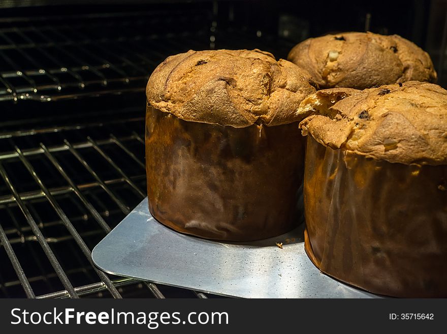 3 Loaves of Delicious Panettone coming out of oven. 3 Loaves of Delicious Panettone coming out of oven