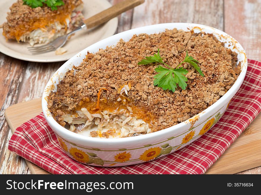 Gratin with fish and pumpkin, horizontal, close-up