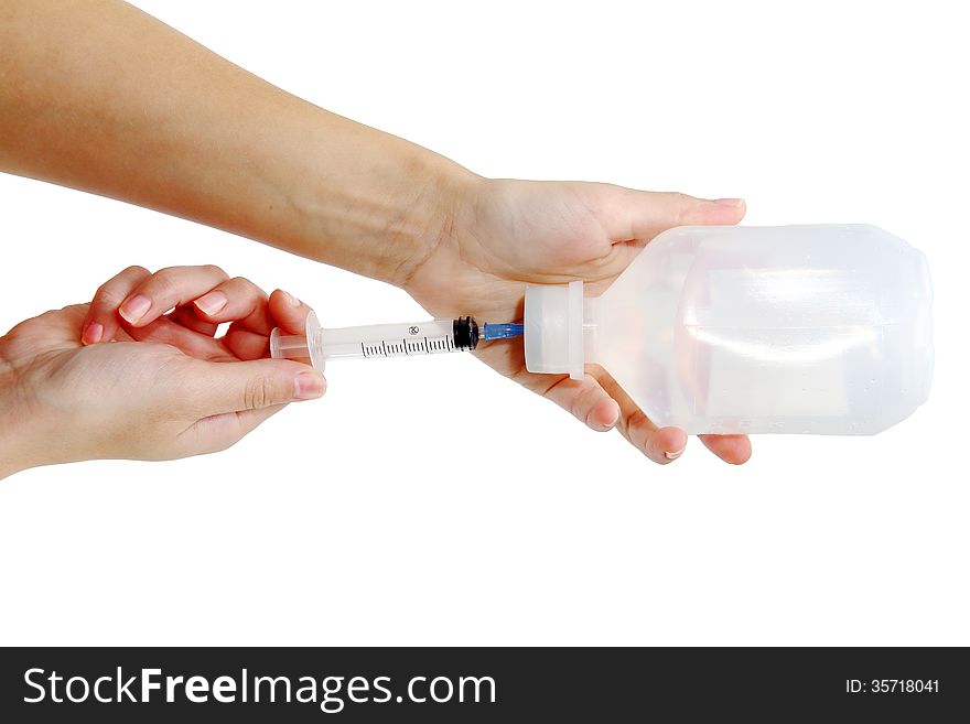 Syringe and Vial. Filling Syringe from Medicine Vial isolated on white background