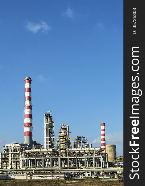 A section of an oil and gas refinery with various petrochemical installations. A section of an oil and gas refinery with various petrochemical installations