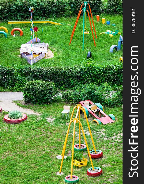 Playground for children in the garden on a sunny day