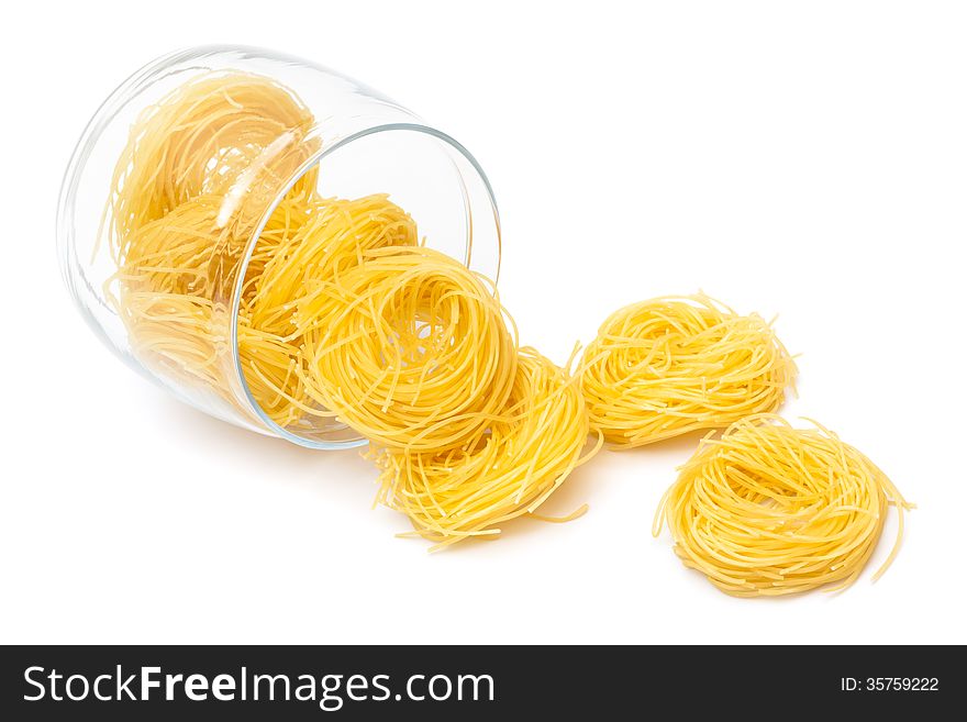 Pasta in glass jar on a white background