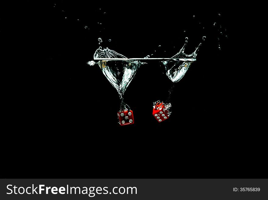 Red splashing dice on black background