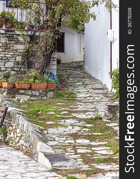 A little alley with rocks and plants in Makrinitsa village, Pelion, Greece. A little alley with rocks and plants in Makrinitsa village, Pelion, Greece