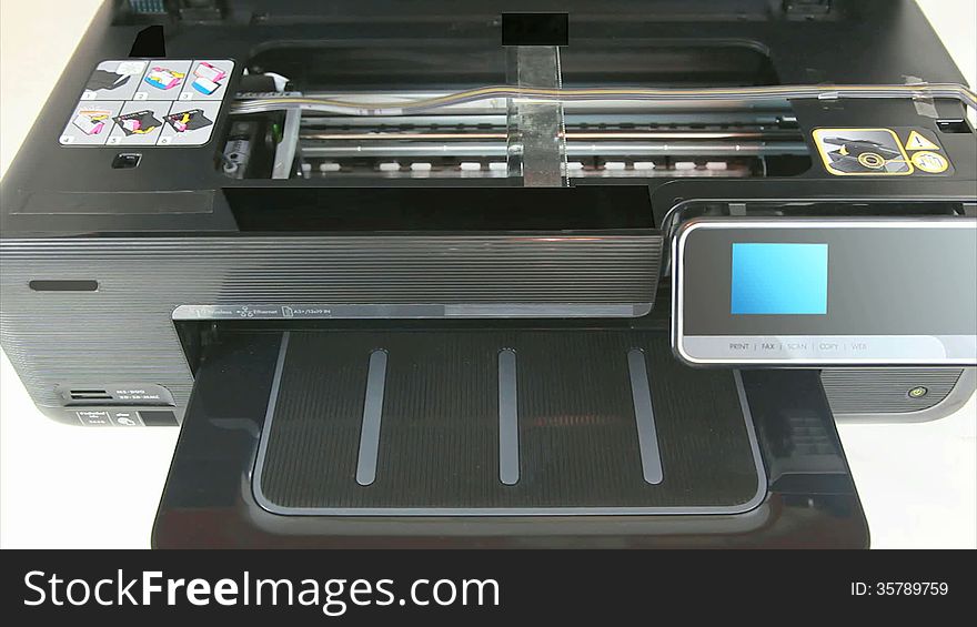 Inkjet printer working as proofed with printed CMYK color calibration target - HD Video. Inkjet printer working as proofed with printed CMYK color calibration target - HD Video