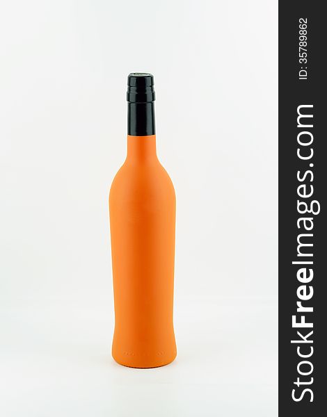 Orange wine bottle on white background