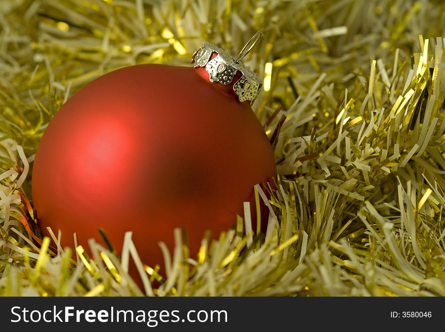 Shiny yellow christmas background with red ball