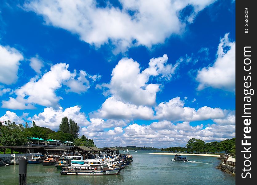 An ferry terminal at a river mouth under a cloudy sky. An ferry terminal at a river mouth under a cloudy sky