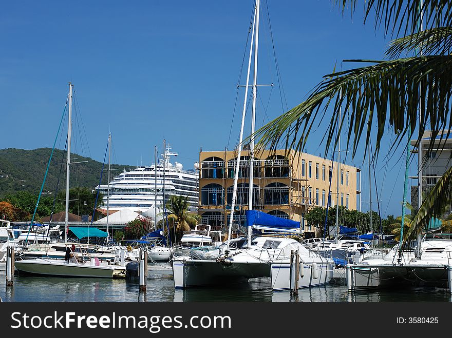 Marina harbour in Road Town with a cruise liner in a background (Tortola, British Virgin Islands).