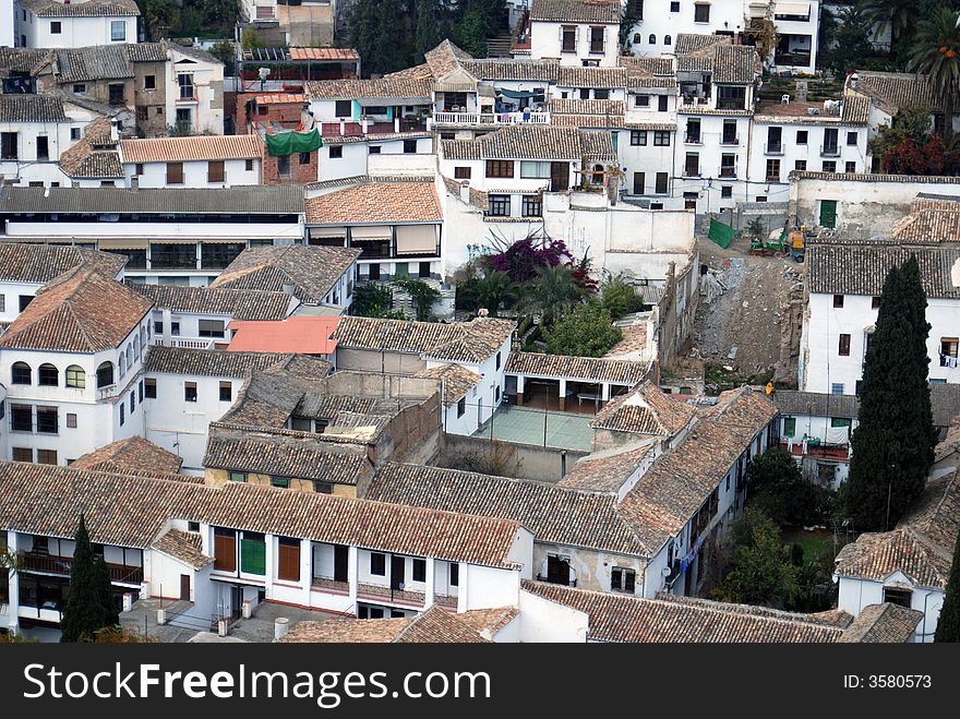 Aerial view of housing in Granada, Spain- For the most part, Europeans hang dry their clothes and linens, as seen in the photo. Also, there were no people outside. Aerial view of housing in Granada, Spain- For the most part, Europeans hang dry their clothes and linens, as seen in the photo. Also, there were no people outside.